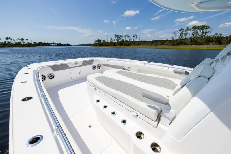 Slide: The Image of 2024 Invincible 37 Catamaran with spacious seating on calm waters. - 30