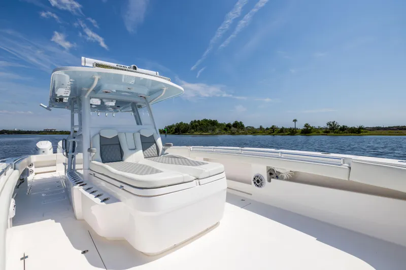 Slide: The Image of 2024 Invincible 37 Catamaran on water, featuring sleek design and spacious deck. - 34