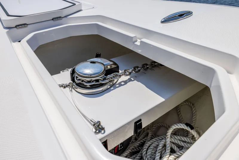Slide: The Image of Anchor storage compartment on 2024 Invincible 37 Catamaran, featuring chain and rope. - 36
