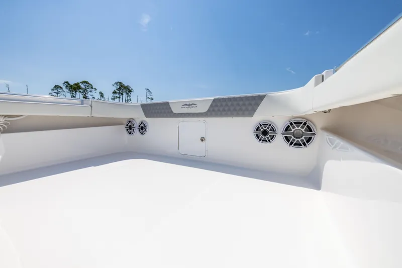 Slide: The Image of 2024 Invincible 37 Catamaran deck with speakers and storage compartment. - 38