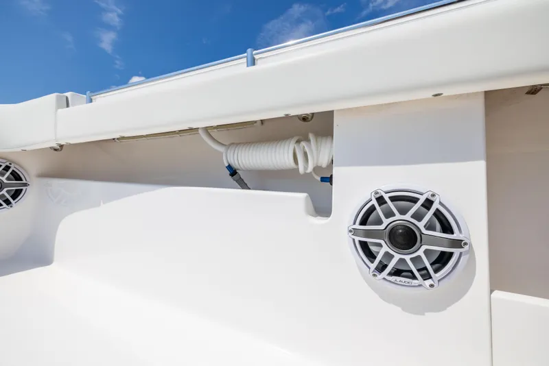 Slide: The Image of 2024 Invincible 37 Catamaran speaker and coiled hose detail against blue sky. - 39