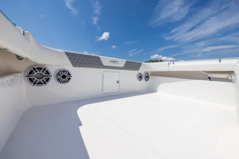 Slide: The Image of 2024 Invincible 37 Catamaran deck with speakers under a clear blue sky. - 40