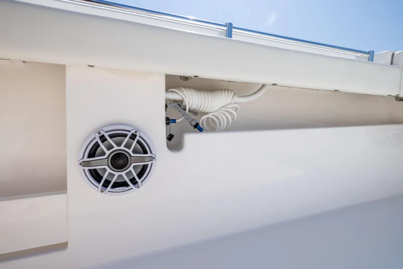 Slide: The Image of 2024 Invincible 37 Catamaran speaker and coiled hose detail. - 41