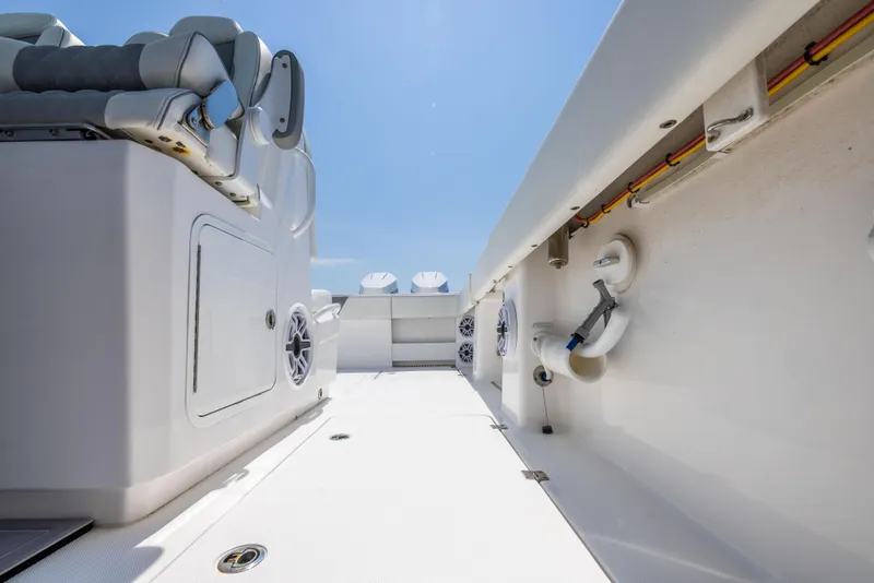 Slide: The Image of 2024 Invincible 37 Catamaran interior, showcasing sleek design and modern features under a clear sky. - 45