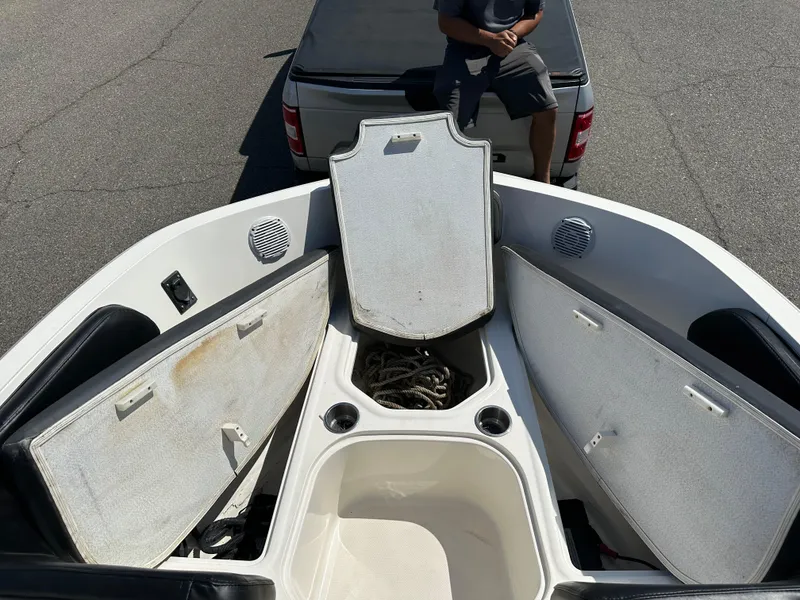 Slide: The Image of 2020 Bayliner VR6 Bowrider OB with open storage compartments and anchor locker. - 10