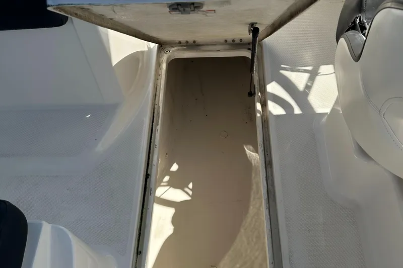 Slide: The Image of Open storage compartment on a 2020 Bayliner VR6 Bowrider OB boat. - 14