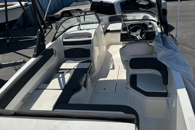 Slide: The Image of 2020 Bayliner VR6 Bowrider OB interior with seating and steering console. - 17