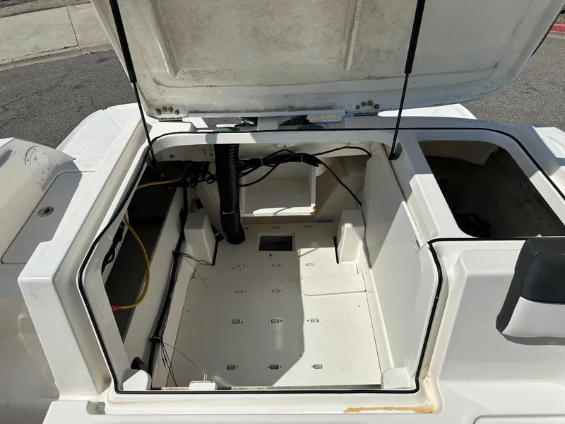Slide: The Image of 2020 Bayliner VR6 Bowrider OB engine compartment with open hatch. - 18