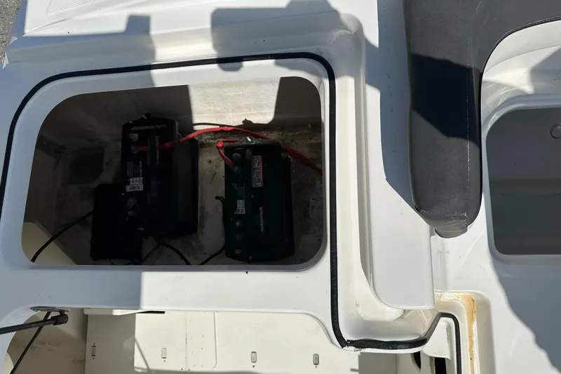 Slide: The Image of 2020 Bayliner VR6 Bowrider OB battery compartment with two batteries. - 22