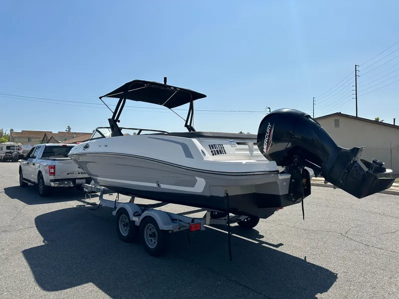 Slide: The Image of 2020 Bayliner VR6 Bowrider OB on trailer, attached to a white pickup truck. - 4