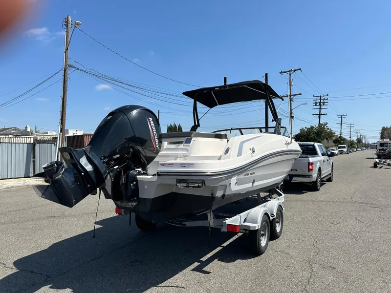 Slide: The Image of 2020 Bayliner VR6 Bowrider OB on trailer, parked on street, rear view. - 5