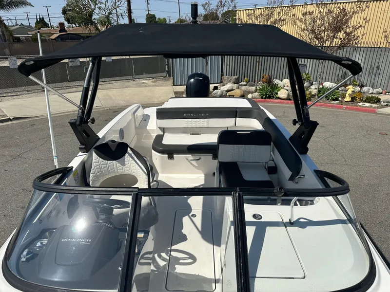 Slide: The Image of 2020 Bayliner VR6 Bowrider OB with black canopy and spacious seating. - 8