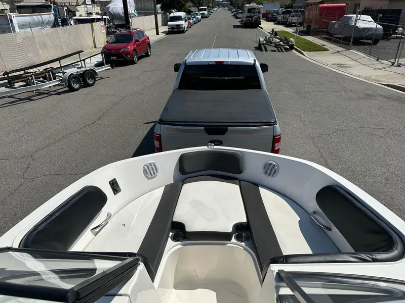 Slide: The Image of 2020 Bayliner VR6 Bowrider OB being towed by a truck on a street. - 9