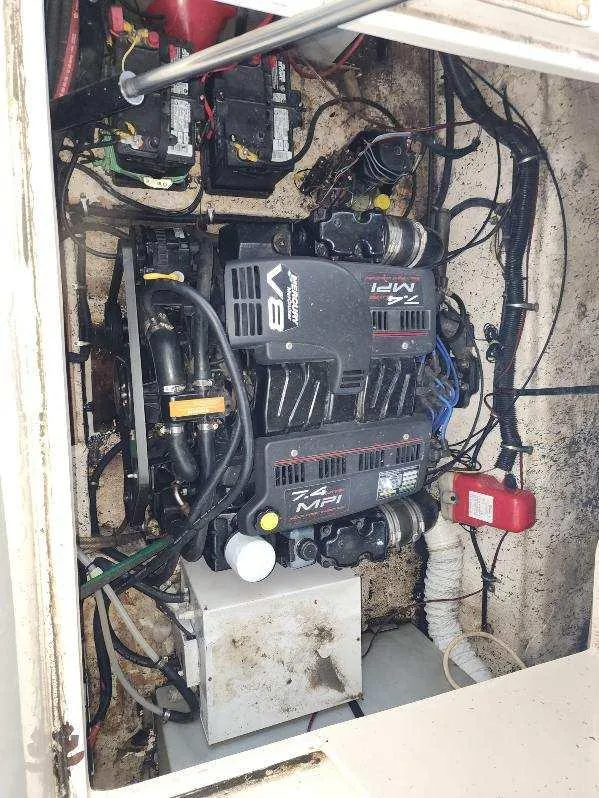 Slide: The Image of Engine compartment of a 2000 Rinker 270 Express Cruiser with V8 engine and batteries. - 21