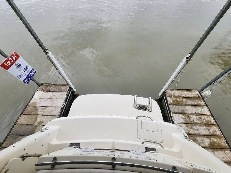 Slide: The Image of 2000 Rinker 270 Express Cruiser docked, with "For Sale" sign visible. - 28