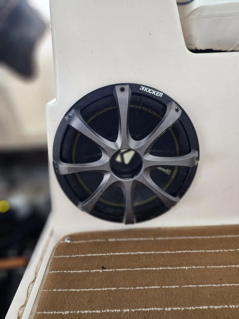 Slide: The Image of Kicker speaker on 2000 Rinker 270 Express Cruiser boat interior. - 5