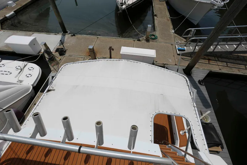 Slide: The Image of Overhead view of a 1991 Viking 50 Convertible yacht docked at a marina. - 15