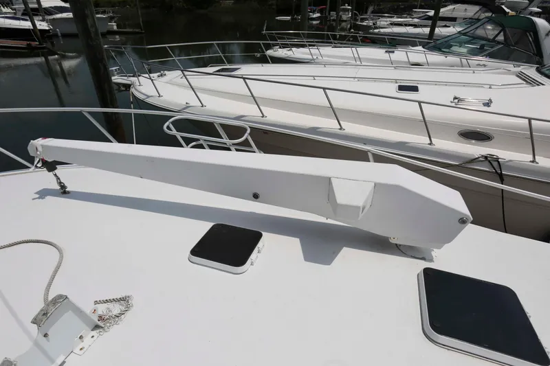 Slide: The Image of Rooftop view of a 1991 Viking 50 Convertible yacht with a davit crane. - 18