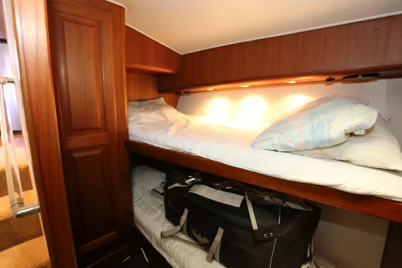 Slide: The Image of Bunk beds in 1991 Viking 50 Convertible yacht cabin with wooden interior. - 37