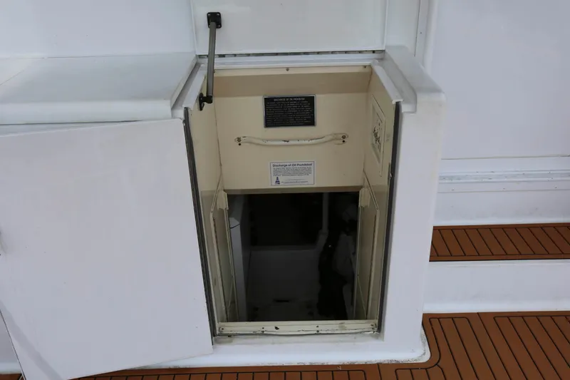 Slide: The Image of Open hatch on 1991 Viking 50 Convertible yacht, revealing interior access. - 42