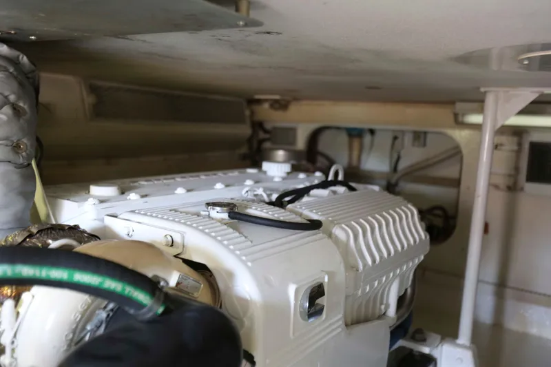 Slide: The Image of Engine room of a 1991 Viking 50 Convertible yacht, showcasing detailed machinery. - 44