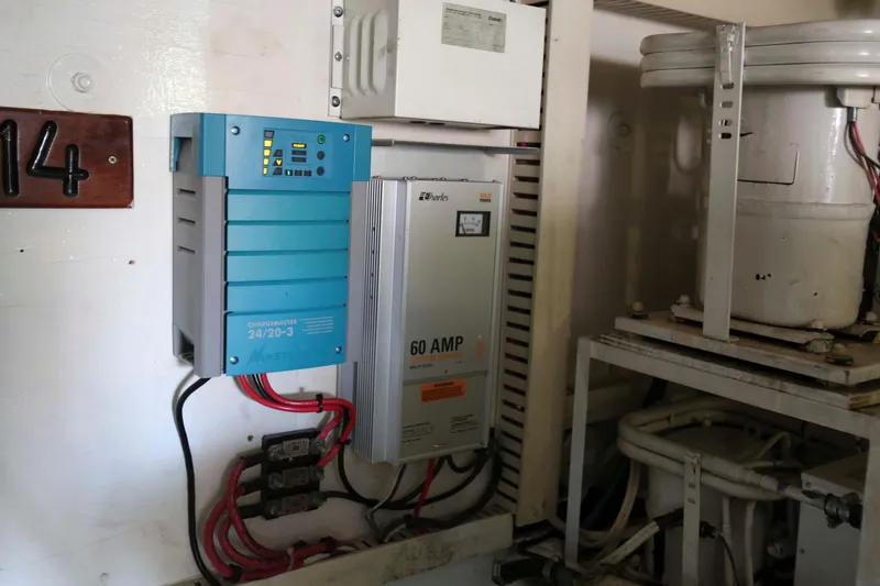 Slide: The Image of Electrical equipment in a 1991 Viking 50 Convertible boat engine room. - 46