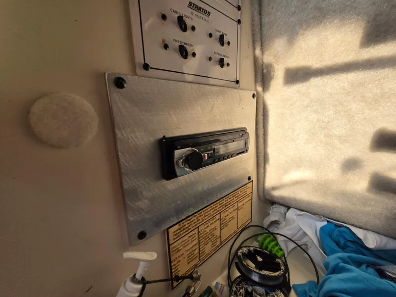 Slide: The Image of 1996 Stratos 2500 Walkaround cabin interior with control panel and stereo system. - 10