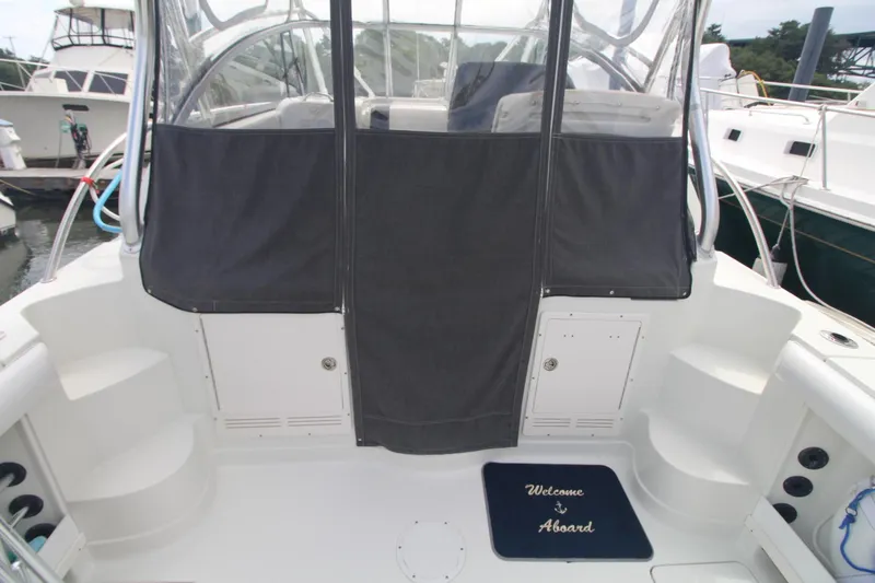 Slide: The Image of 2007 Sailfish 3006 WALKAROUND boat interior with "Welcome Aboard" mat. - 11