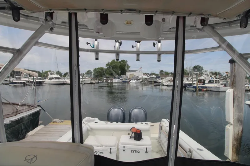 Slide: The Image of 2007 Sailfish 3006 WALKAROUND boat docked at marina, view from cockpit. - 15