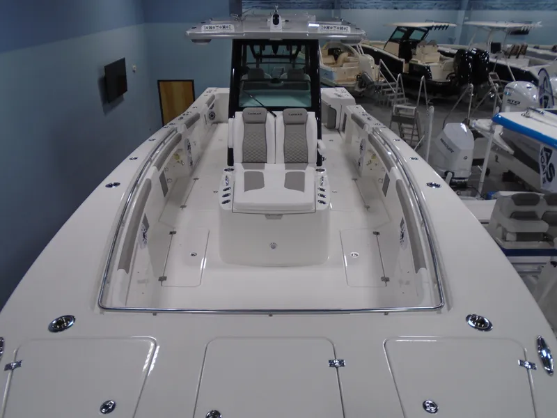 Slide: The Image of 2026 Caymas 34 CT boat interior with seating, displayed in showroom. - 13