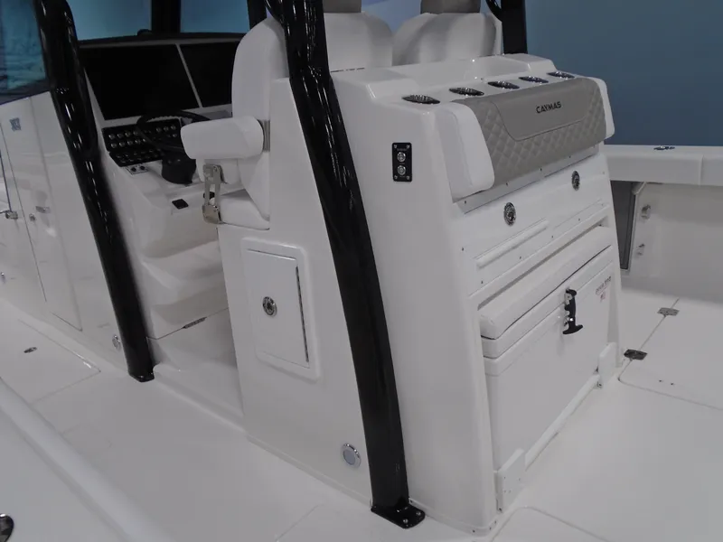 Slide: The Image of 2026 Caymas 34 CT boat interior with helm station and seating. - 14