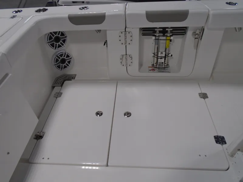 Slide: The Image of 2026 Caymas 34 CT boat deck with storage compartments and speakers. - 16