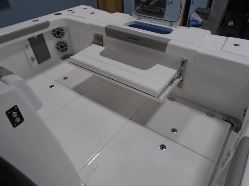Slide: The Image of 2026 Caymas 34 CT boat interior with foldable seating and storage compartments. - 20