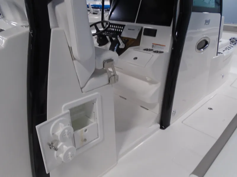 Slide: The Image of 2026 Caymas 34 CT boat interior with modern helm and seating. - 25