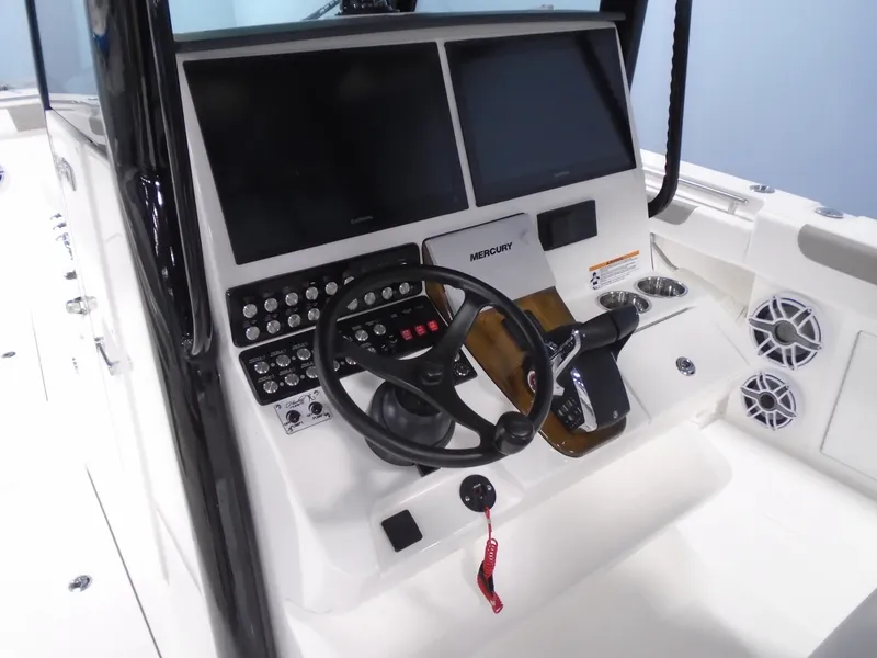 Slide: The Image of 2026 Caymas 34 CT boat dashboard with steering wheel and control panel. - 28