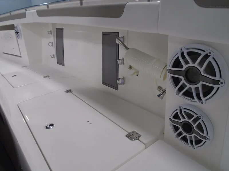 Slide: The Image of 2026 Caymas 34 CT boat interior with speakers and storage compartments. - 32