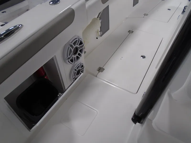 Slide: The Image of 2026 Caymas 34 CT boat interior with storage compartments and speakers. - 33