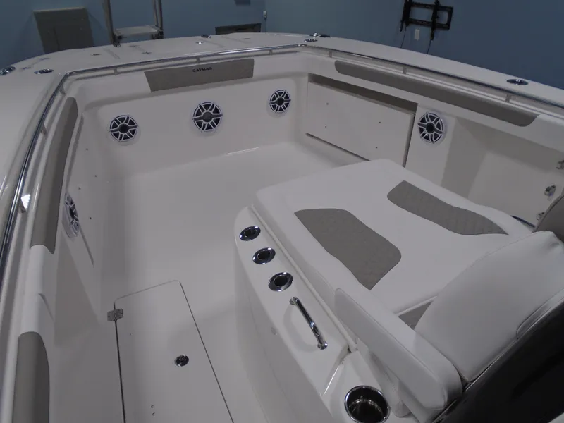 Slide: The Image of 2026 Caymas 34 CT boat interior with cushioned seating and built-in speakers. - 39