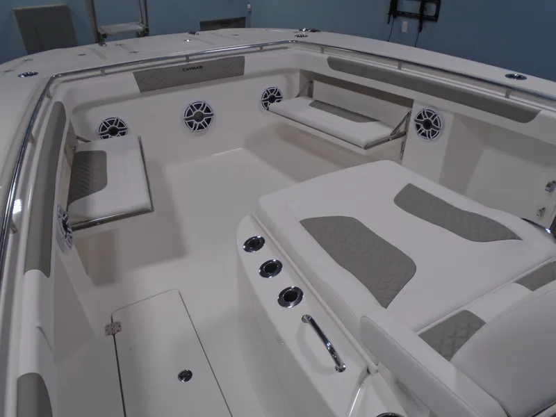 Slide: The Image of 2026 Caymas 34 CT boat interior with cushioned seating and built-in speakers. - 40