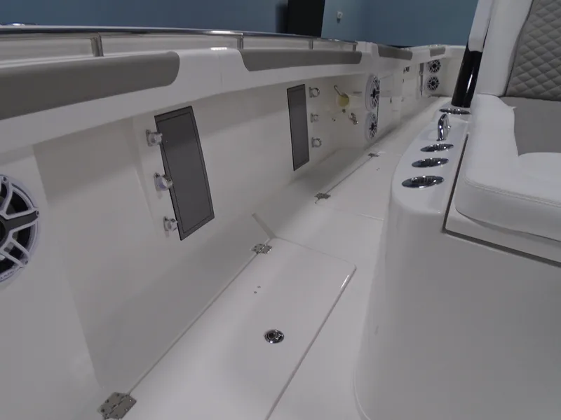 Slide: The Image of 2026 Caymas 34 CT boat interior with seating and storage compartments. - 45