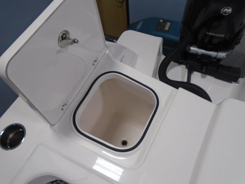 Slide: The Image of 2026 Caymas 34 CT boat storage compartment with open lid and visible engine components. - 46