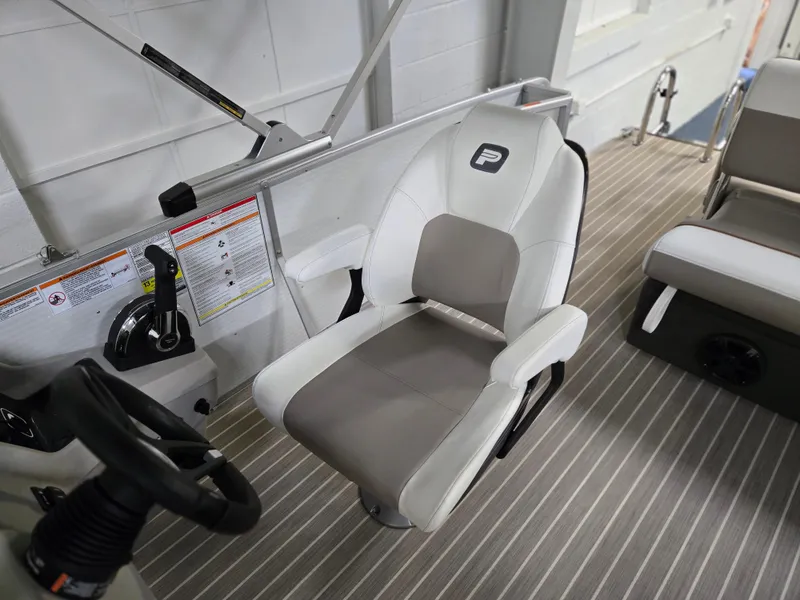 Slide: The Image of Captain's chair on 2025 Princecraft Vectra 23 WRL boat, featuring modern design and controls. - 11