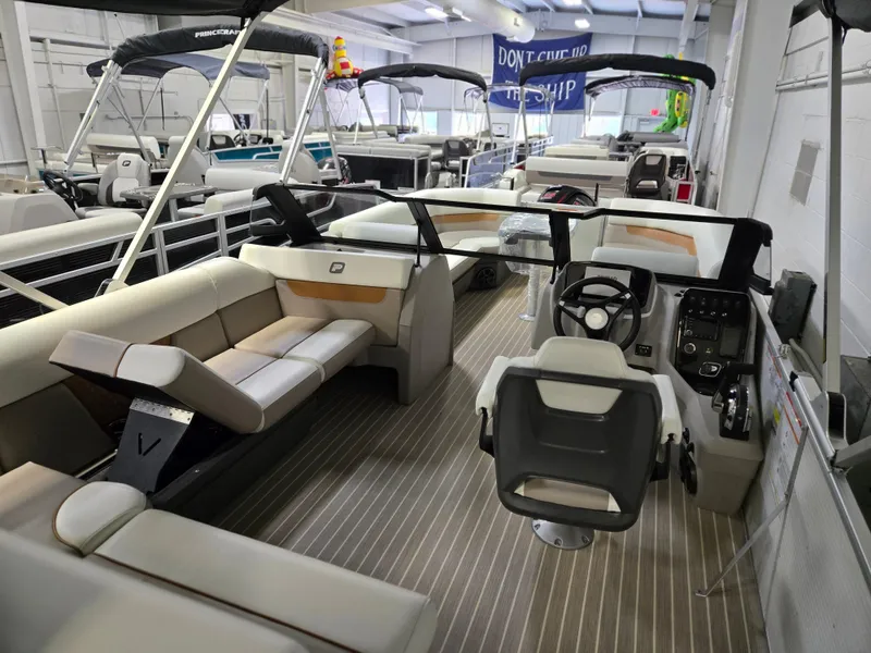 Slide: The Image of 2025 Princecraft Vectra 23 WRL pontoon boat interior with modern seating and steering console. - 13