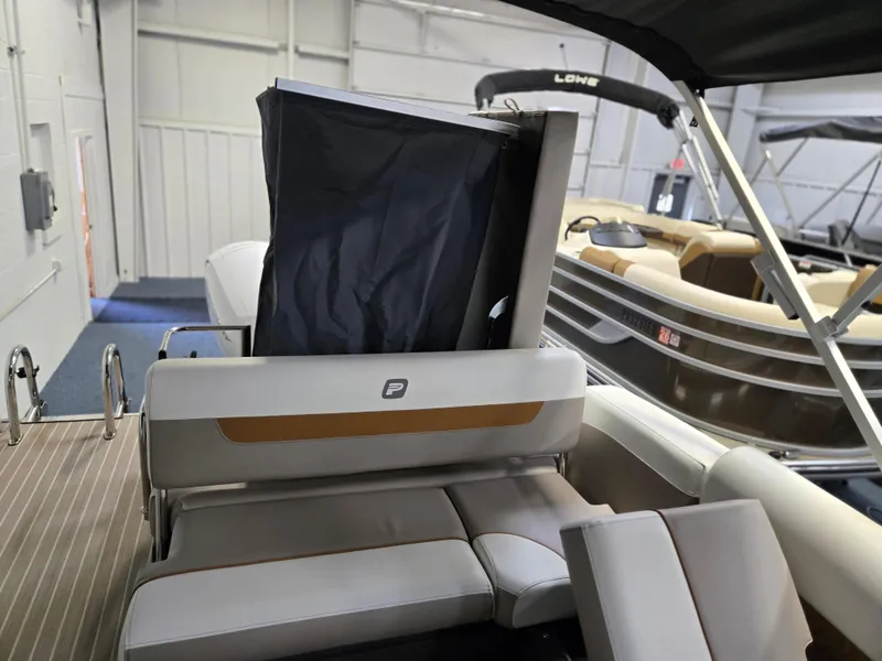 Slide: The Image of 2025 Princecraft Vectra 23 WRL boat interior with seating and storage compartment. - 14