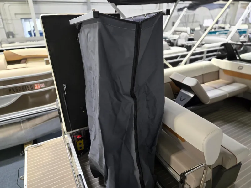 Slide: The Image of 2025 Princecraft Vectra 23 WRL boat interior with privacy curtain and seating area. - 21