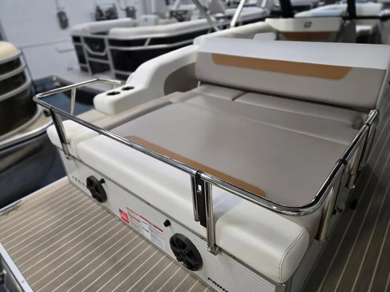Slide: The Image of 2025 Princecraft Vectra 23 WRL boat interior with cushioned seating and stainless steel railing. - 24