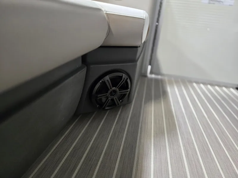 Slide: The Image of 2025 Princecraft Vectra 23 WRL boat interior with speaker and striped flooring. - 5