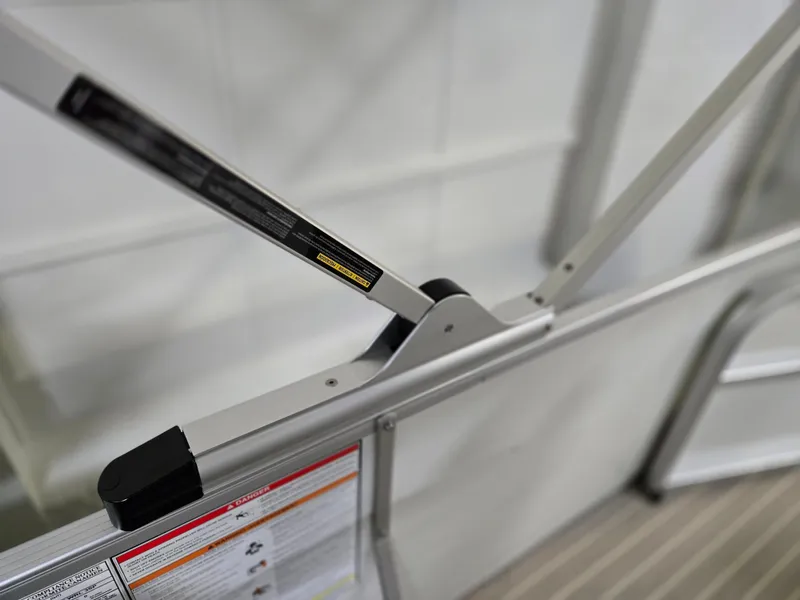 Slide: The Image of 2025 Princecraft Vectra 23 WRL boat railing with safety instructions and warning labels. - 6