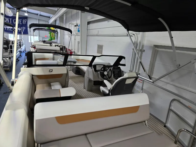 Slide: The Image of 2025 Princecraft Vectra 23 WRL pontoon boat interior with seating and steering console. - 7
