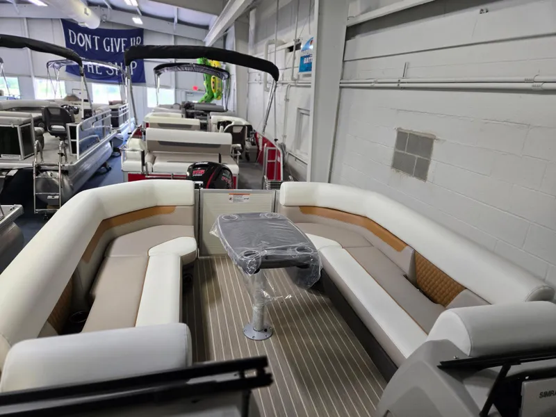 Slide: The Image of 2025 Princecraft Vectra 23 WRL pontoon boat interior with spacious seating and table. - 8